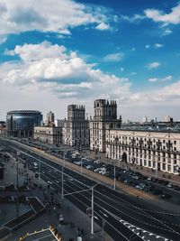 High angle view of road by buildings against sky