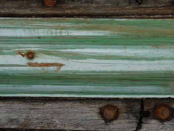 Close-up of rusty wooden plank