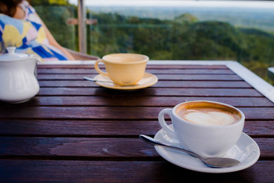 Coffee cup on wooden table