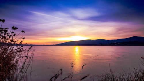 Scenic view of sea against sky during sunset