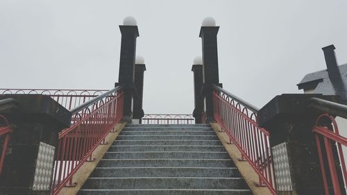 Metal railing against clear sky