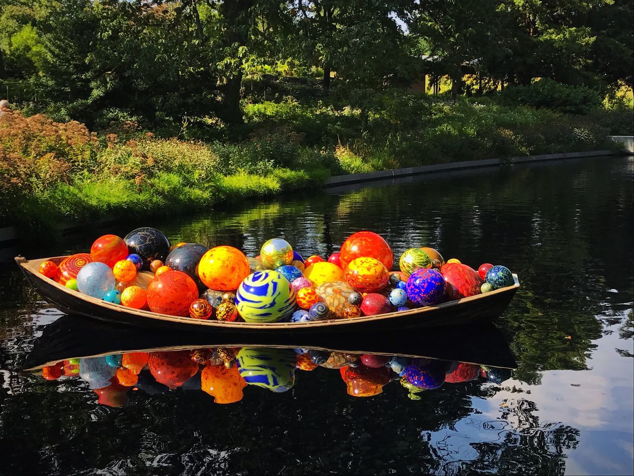 water, lake, nature, tree, reflection, day, plant, multi colored, nautical vessel, no people, outdoors, transportation, in a row, food and drink, food, tranquility, waterfront, floating on water