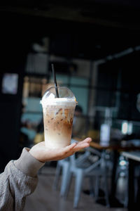 Close-up of hand holding drink