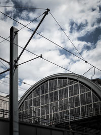 Berlin alexanderplatz station against cloudy sky in city