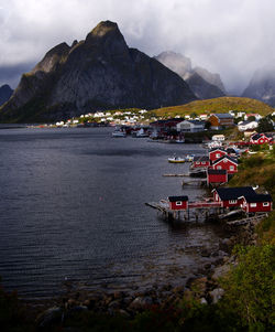 Scenic view of sea and mountains against sky