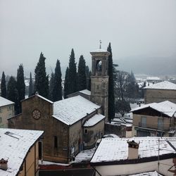 Houses against clear sky during winter