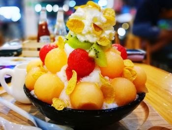 Close-up of served fruits in plate