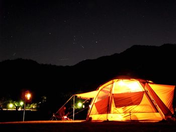 Scenic view of landscape against sky at night