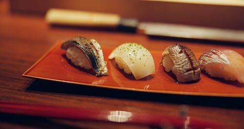 Close-up of sushi served on table