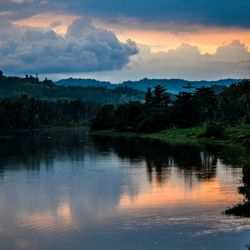 Scenic view of lake against cloudy sky