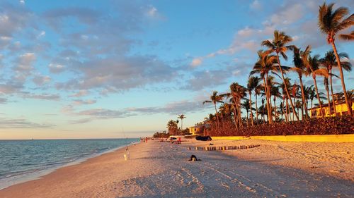 Scenic view of beach against sky during sunset
