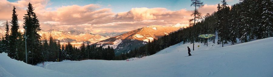 Scenic view of snow covered mountains against sky