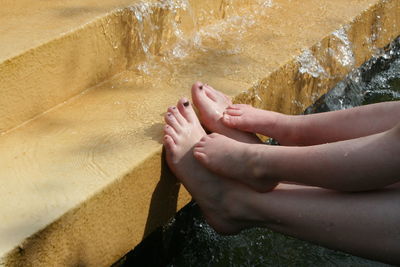 Low section of man legs in water