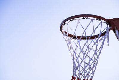 Low angle view of basketball hoop against clear sky