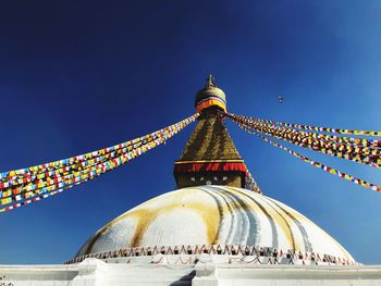 Low angle view of traditional building against blue sky