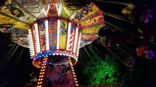 Low angle view of illuminated lights at night