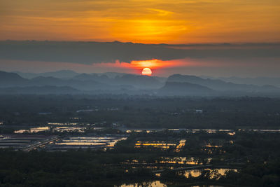 Aerial view of townscape against sky during sunset