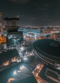 High angle view of illuminated city buildings at night