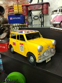 View of yellow car on street