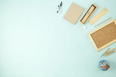 High angle view of objects on table against white background