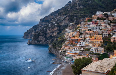 Panoramic view of sea and buildings against sky