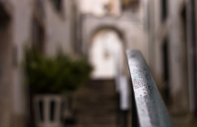 Close-up of metal fence against temple