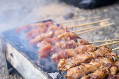 Close-up of meat on barbecue grill