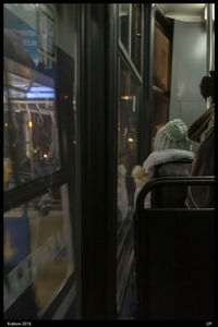 Rear view of train seen through glass window