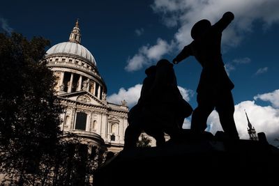 Low angle view of statue against building