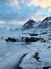 Scenic view of frozen landscape against sky