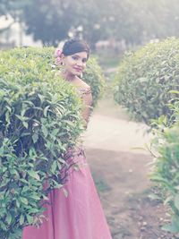 Portrait of young woman standing outdoors