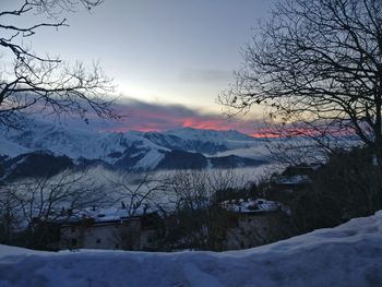 Scenic view of mountains against sky during winter