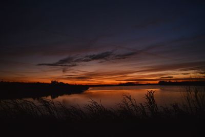 Scenic view of lake during sunset