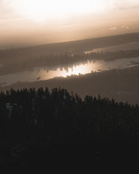 Scenic view of silhouette landscape against sky during sunset