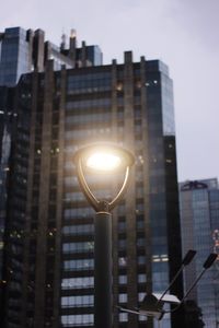 Low angle view of illuminated buildings against sky