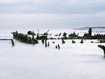 Sunken shipwreck from a world war ship in short distance of a beach in northern france,