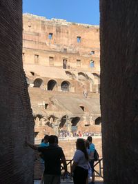 Group of people in front of historical building