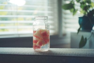 Close-up of drink in glass jar on table