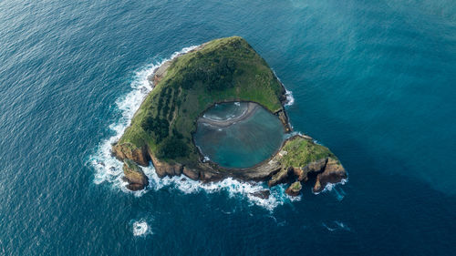 Aerial view of island amidst sea