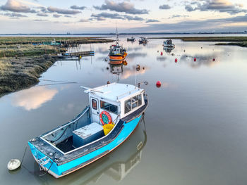 Small fishing boats moored at stone creek inlet, sunk island, east yorkshire, uk