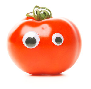 Close-up of red bell over white background