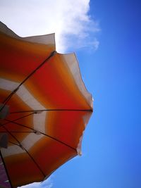 Low angle view of parasol against sky