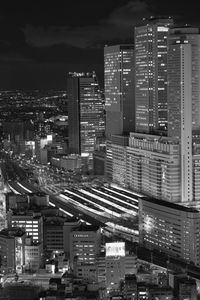 High angle view of illuminated buildings in city at night