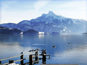 Scenic view of lake and mountains against sky