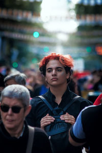 Man and woman standing in front of crowd