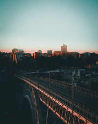 High angle view of railroad tracks by buildings against sky