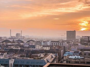 High angle view of buildings against sky during sunset