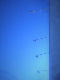 Low angle view of airplane flying in sky