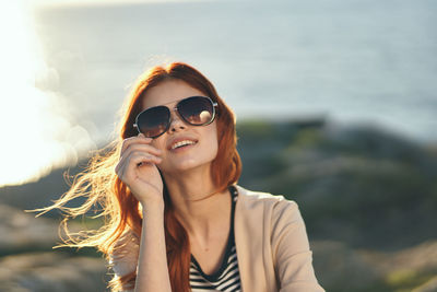 Portrait of young woman wearing sunglasses