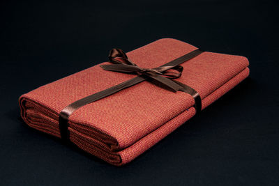 High angle view of leather tied on book